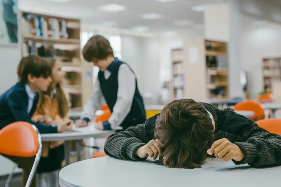 Nonverbal child struggling to engage with peers in school setting